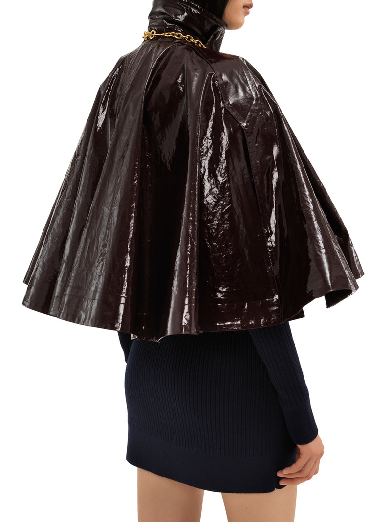 Short poncho in lacquered cotton