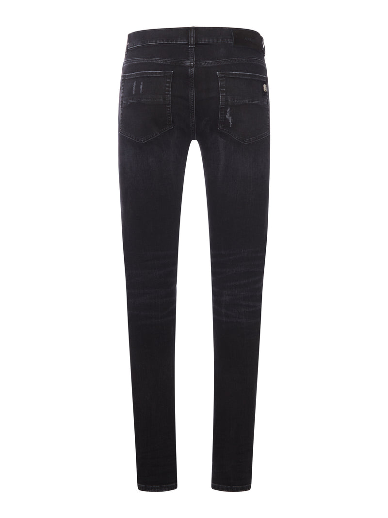 SKINNY JEANS WITH STUDS AND DESTROY DETAILS